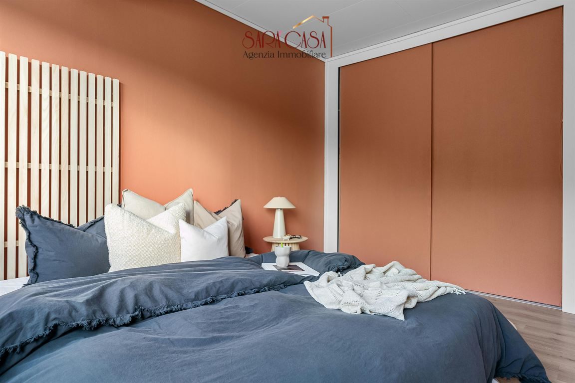 Appartamento con tre camere da letto e giardino